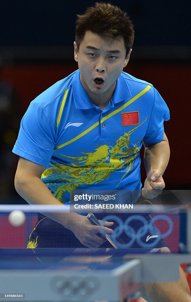 Wang Hao of China celebrates winning a p