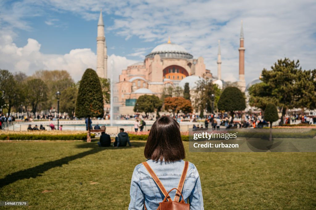 Young Woman Enjoying The View Of Hagia Sofia In Istanbul