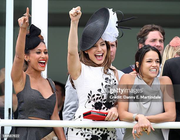 Preeya Kalidas, Kelly Brook and Michelle Rodriguez watch ladies day at 'Glorious Goodwood' at Goodwood on August 2, 2012 in Chichester, England.