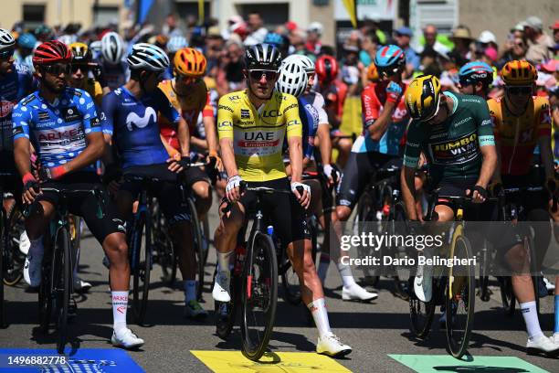 Donavan Grondin of France and Team Arkéa Samsic - Polka dot Mountain Jersey, Mikkel Bjerg of Denmark and UAE Team Emirates - Yellow leader jersey and...