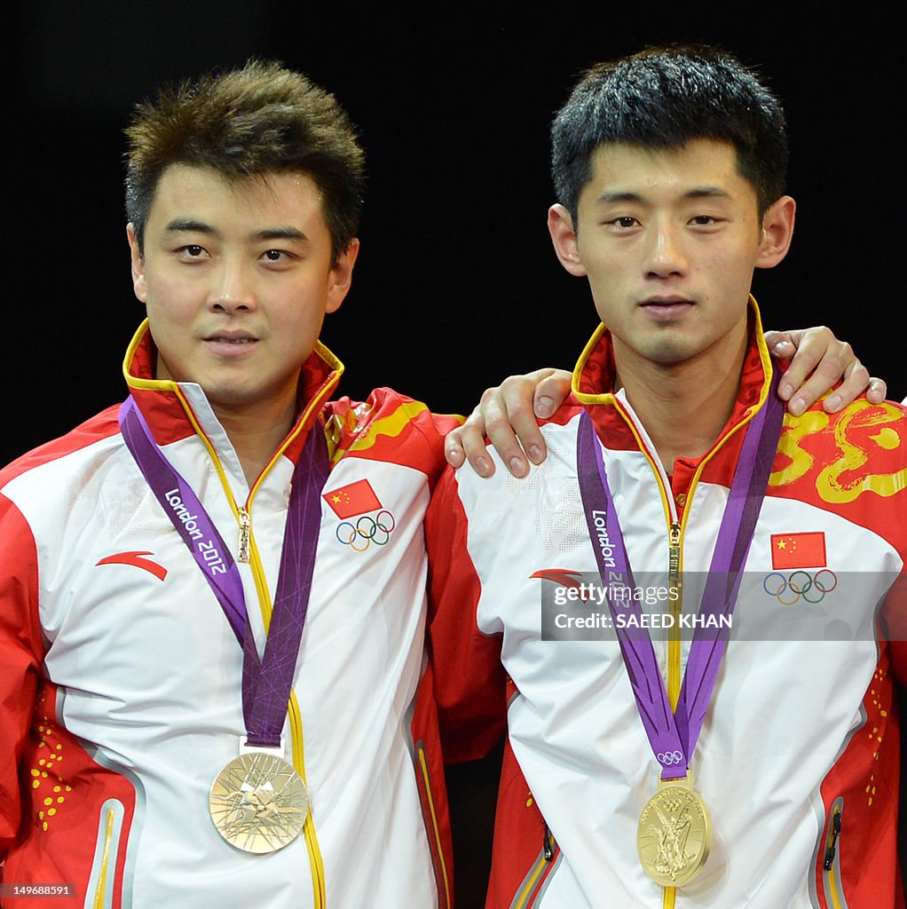 Gold medallist Zhang Jike of China (R) p