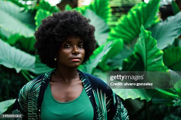 youtng conservation and climate activist looking directly to camera - climate protest stock pictures, royalty-free photos & images