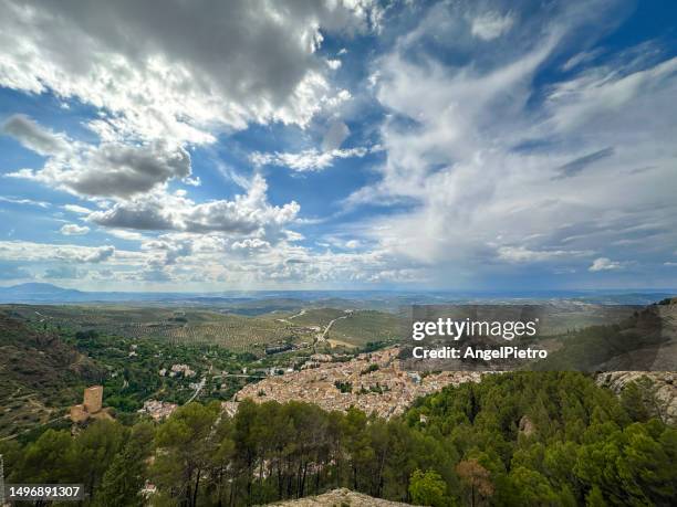 dramatic sky over the town of cazorla. - cazorla stock pictures, royalty-free photos & images