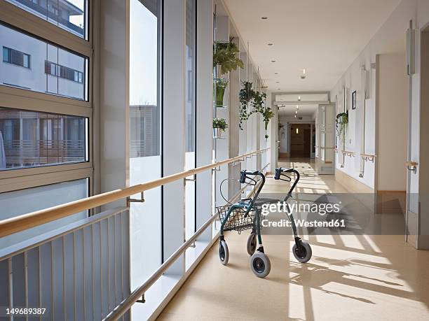 germany, cologne, walking frame in corridor of nursing home - sheltered housing stock-fotos und bilder