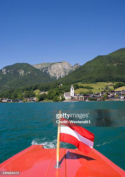austria, boat with flag in wolfgangsee lake - austria flag stock pictures, royalty-free photos & images