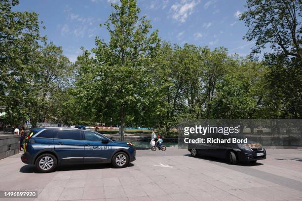 Law enforcement stand near a park where a man stabbed multiple people on June 8, 2023 in Annecy, France. Four children were among the victims in a...