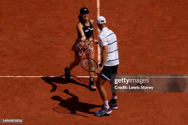 Miyu Kato of Japan celebrates a point with partner Tim Puetz of Germany against Bianca Andreescu of Canada and Michael Venus of New Zealand during...