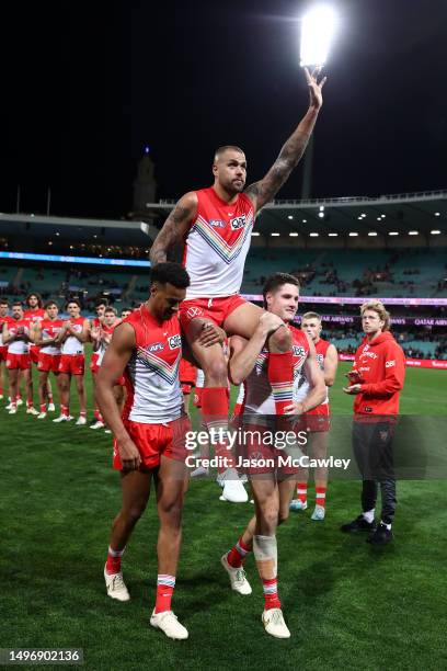 Lance Franklin of the Swans is chaired off the field after playing his 350th game during the round 13 AFL match between Sydney Swans and St Kilda...