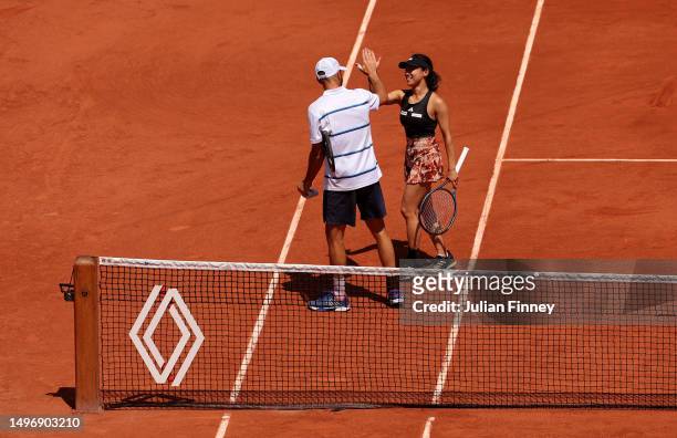 Miyu Kato of Japan and partner Tim Puetz of Germany celebrate winning match point against Bianca Andreescu of Canada and Michael Venus of New Zealand...
