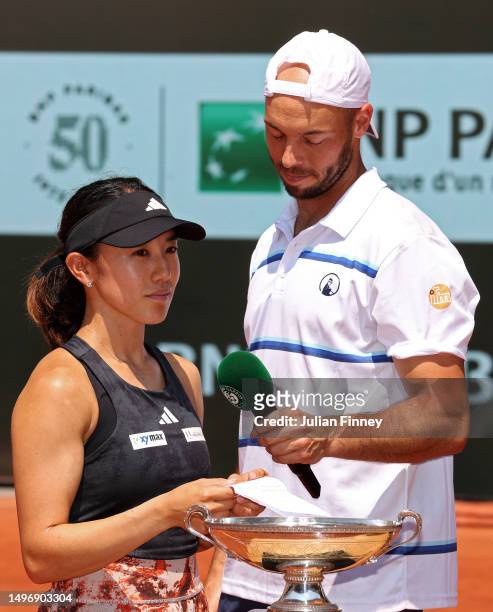 Miyu Kato of Japan and partner Tim Puetz of Germany speak to the crowd after winning match point against Bianca Andreescu of Canada and Michael Venus...