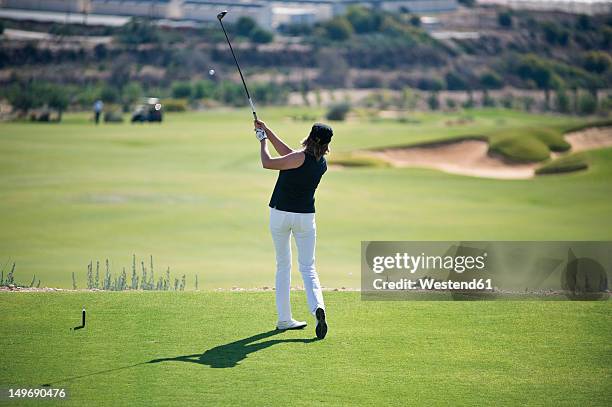 cyprus, woman playing golf on golf course - golf woman ストックフォトと画像