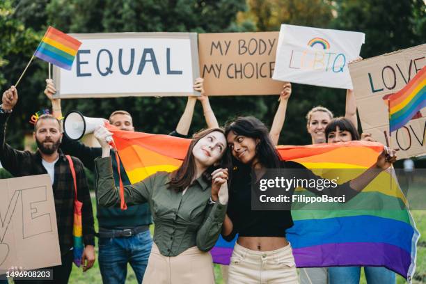 people are enjoying an lgbtqia pride event - indian lesbian stock pictures, royalty-free photos & images