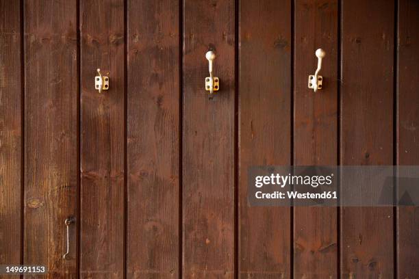 germany, bavaria, coat hooks on wood wall - coat rack stock pictures, royalty-free photos & images