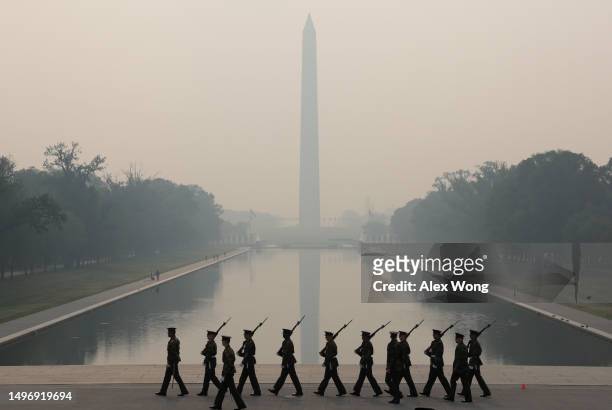 Members of the U.S. Marine Corps rehearse in hazy smoke for the Sunset Parade at the Lincoln Memorial on June 8, 2023 in Washington, DC. Air quality...
