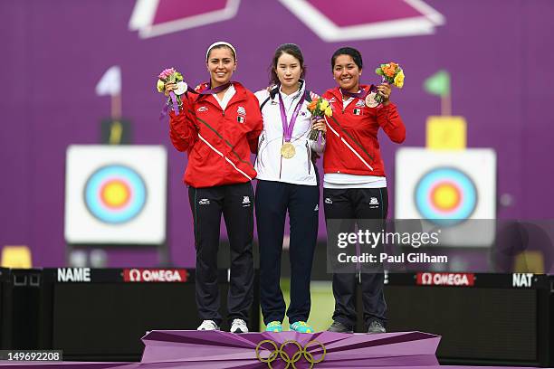 Bobae Ki of Korea celebrates with her Gold Medal on the podium, Aida Roman Arroyo of Mexico the Silver and Mariana Avitia Martinez the Bronze...