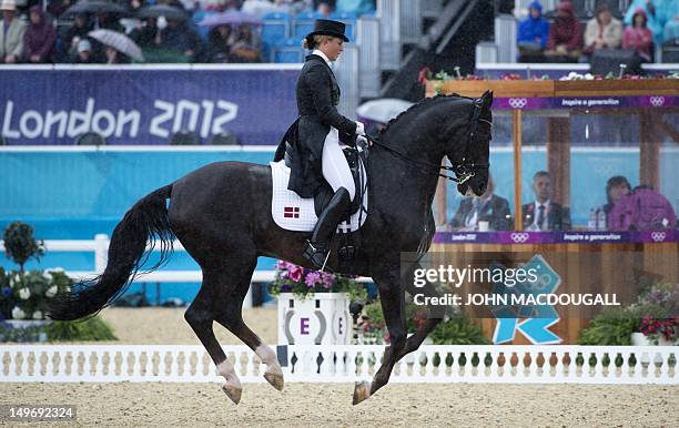 Denmark's Anna Kasprzak on Donnperignon competes in the dressage preliminaries of the London 2012 Olympic Games at the equestrian venue in Greenwich...