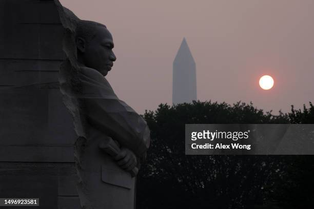 The Martin Luther King Jr. Memorial and the Washington Memorial are covered in hazy smoke on June 8, 2023 in Washington, DC. Air quality alert has...