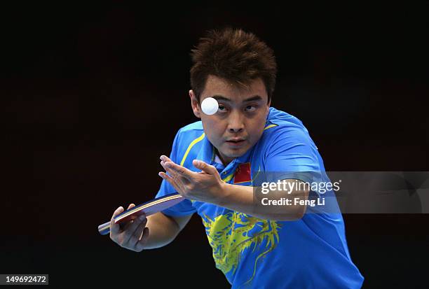 Wang Hao of China serves on during Men's Singles Table Tennis Gold medal match against Zhang Jike of China on Day 6 of the London 2012 Olympic Games...