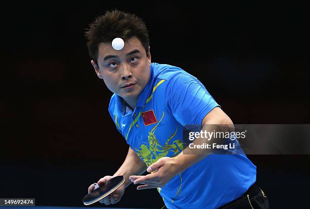 Wang Hao of China serves on during Men's Singles Table Tennis Gold medal match against Zhang Jike of China on Day 6 of the London 2012 Olympic Games...