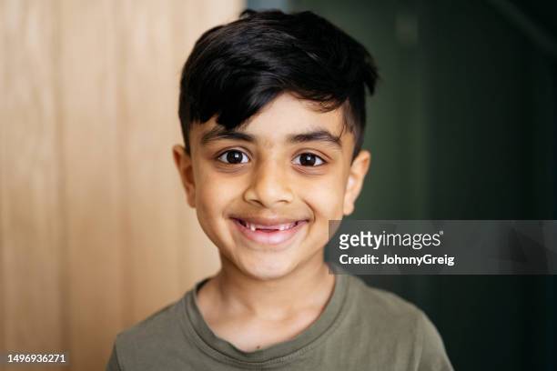 headshot of smiling young boy - smiling child stock pictures, royalty-free photos & images