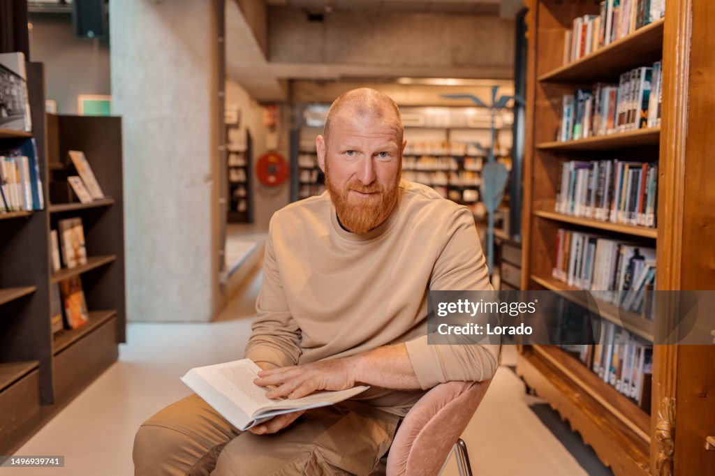 Portrait of an adult reader in a library