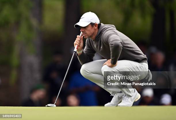 Rory McIlroy of Northern Ireland lines up a putt on the 3rd hole during the first round of the RBC Canadian Open at Oakdale Golf & Country Club on...