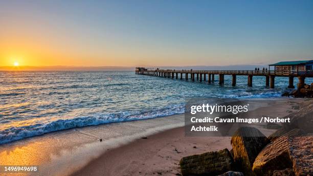 scenic view of old mole on walvis bay, namibia, africa - walvis bay foto e immagini stock