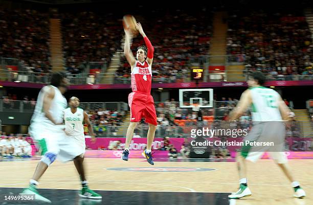 Alexey Shved of Russia puts up a shot against Brazil during the Men's Basketball Preliminary Round match on Day 6 of the London 2012 Olympic Games at...