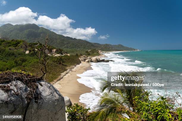 scenic view of sea against sky,parque nacional natural tayrona,magdalena,colombia - colombia beach stock pictures, royalty-free photos & images