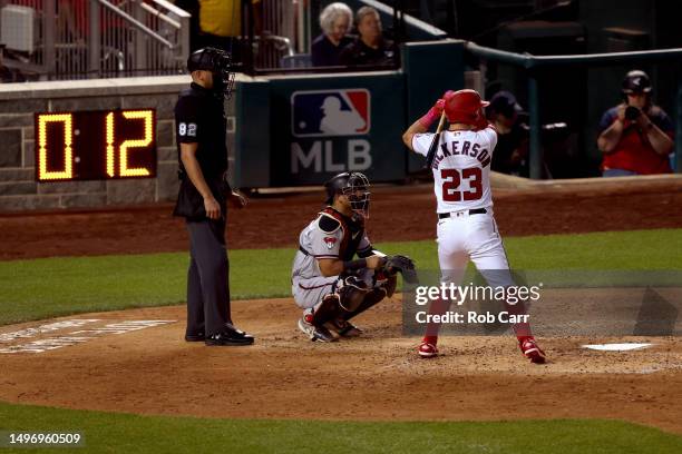 Corey Dickerson of the Washington Nationals bats as the pitch clock counts down against the Arizona Diamondbacks at Nationals Park on June 07, 2023...