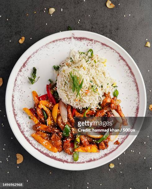 directly above shot of food in plate on table,multan,punjab,pakistan - multan stock pictures, royalty-free photos & images
