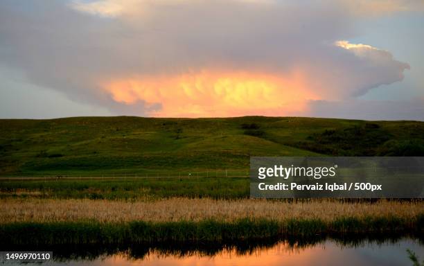 scenic view of field against sky during sunset,saskatchewan,canada - better view sunset stock pictures, royalty-free photos & images