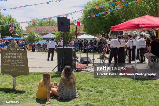 visitors enjoy the mariachi music at the festive gathering for cinco de mayo, in old town mesilla new mexico - cinco personas stock pictures, royalty-free photos & images
