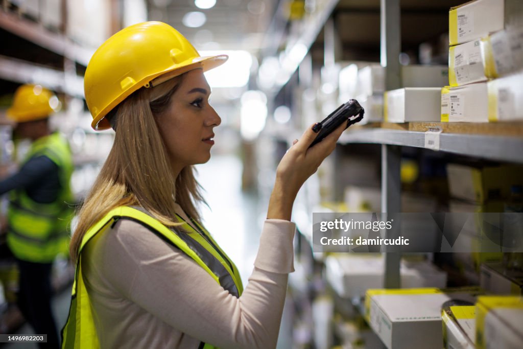 Warehouse Worker Scanning Boxes With Bar Code Scanner High-Res Stock ...