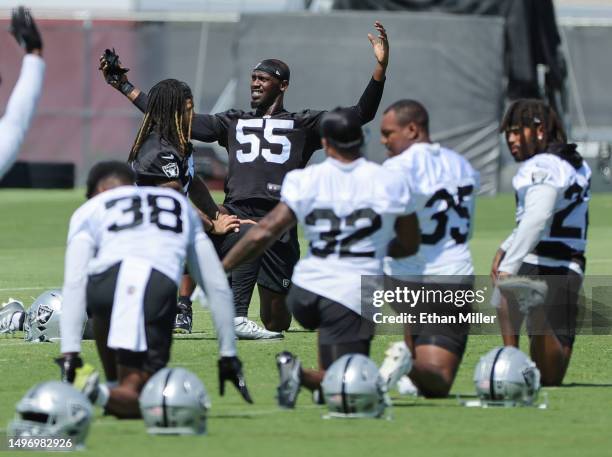 Defensive end Chandler Jones of the Las Vegas Raiders warms up with teammates during mandatory minicamp at the Las Vegas Raiders...