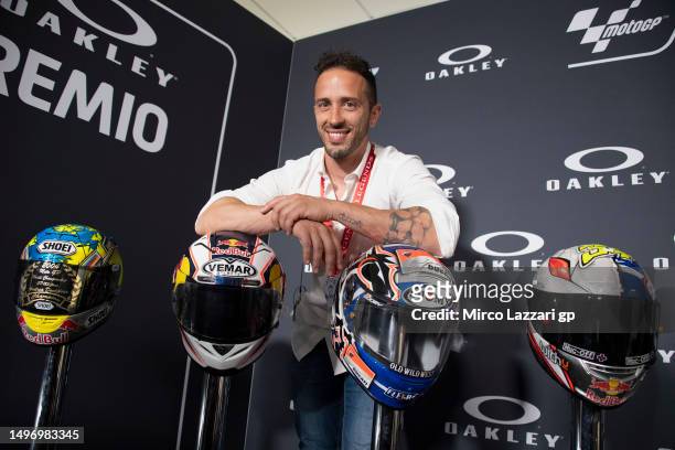 Andrea Dovizioso of Italy poses near the helmets during the MotoGP™ Legends Hall of Fame - Press Conference during the MotoGP of Italy - Previews at...