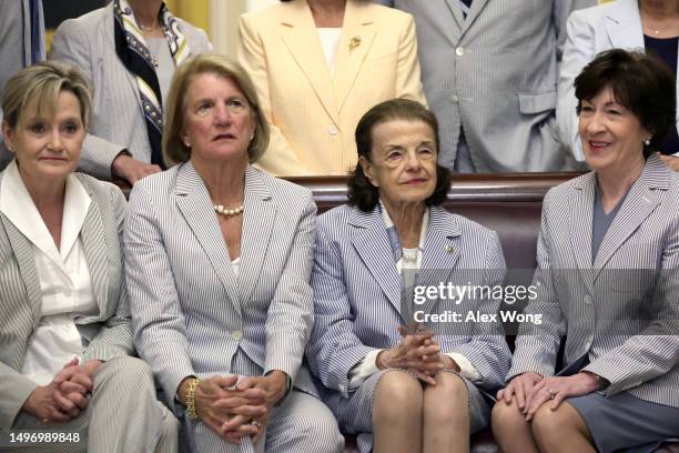 Sen. Cindy Hyde-Smith , Sen. Shelley Moore Capito , Sen. Dianne Feinstein , and Sen. Susan Collins wait to participate in a photo session with...