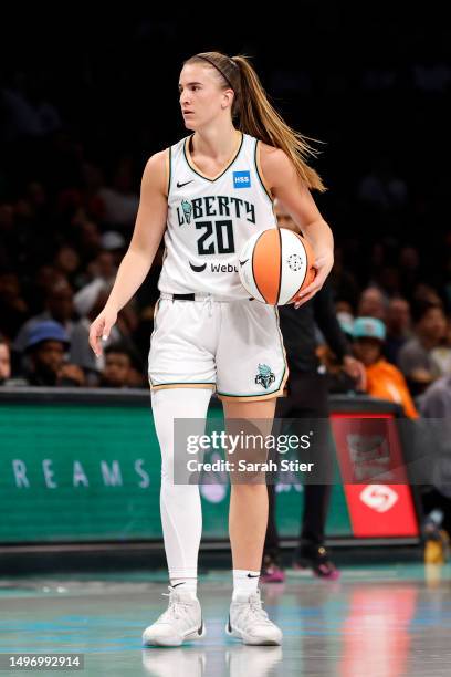 Sabrina Ionescu of the New York Liberty dribbles during the first half against the Chicago Sky at Barclays Center on June 04, 2023 in the Brooklyn...