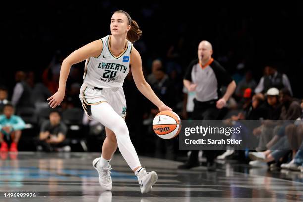 Sabrina Ionescu of the New York Liberty dribbles during the first half against the Chicago Sky at Barclays Center on June 04, 2023 in the Brooklyn...