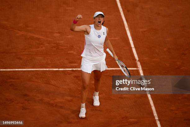 Iga Swiatek of Poland celebrates winning match point against Beatriz Haddad Maia of Brazil during the Women's Singles Semi-Final match on Day Twelve...