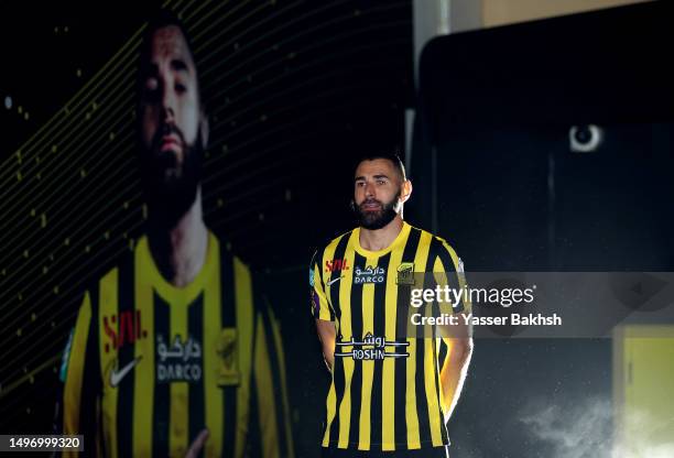 Karim Benzema looks on before they are presented to the crowd during the Karim Benzema Official Reception event at King Abdullah Sports City on June...