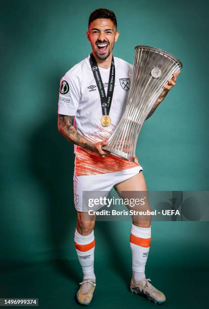 Manuel Lanzini of West Ham United poses for a photograph with the UEFA Europa Conference League trohpy after the UEFA Europa Conference League...