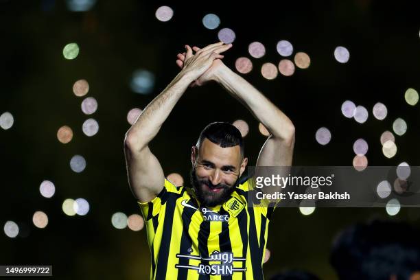 Karim Benzema acknowledges the fans as they are presented to the crowd during the Karim Benzema Official Reception event at King Abdullah Sports City...