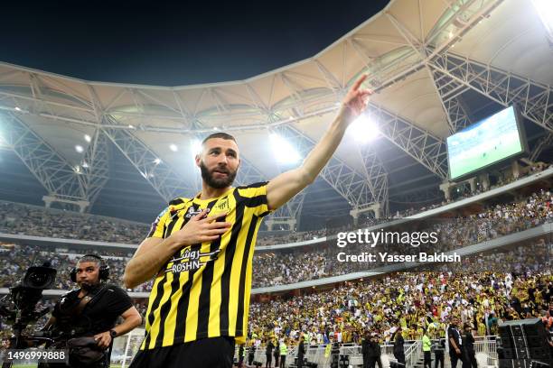 Karim Benzema acknowledges the fans as they are presented to the crowd during the Karim Benzema Official Reception event at King Abdullah Sports City...