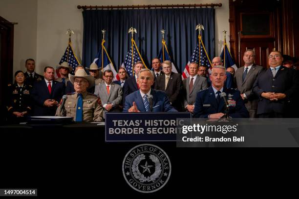 Texas Gov. Greg Abbott speaks alongside Texas Department of Public Safety Director Steve McCraw and Texas Major General Thomas Suelzer during a news...