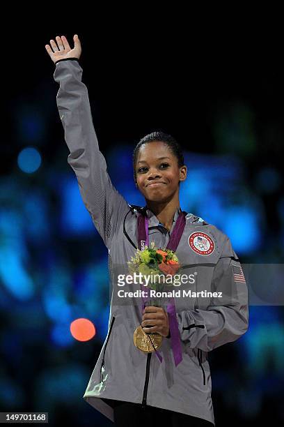 Gabrielle Douglas of the United States celebrates after winning the gold medal in the Artistic Gymnastics Women's Individual All-Around final on Day...