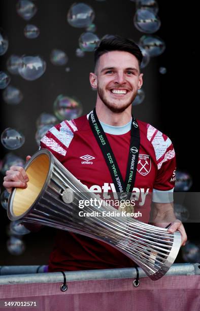 Declan Rice of West Ham United celebrates with the Europa Conference League trophy during the West Ham United trophy parade on June 08, 2023 in...