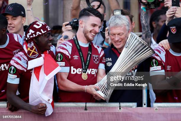 Declan Rice of West Ham United admires the Europa Conference League trophy with David Moyes, Manager of West Ham United, as players of West Ham...