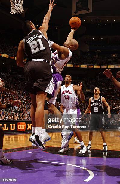 Vince Carter of the Toronto Raptors shoots against Tim Duncan of the San Antonio Spurs at Air Canada Centre in Toronto, Canada. DIGITAL IMAGENOTE TO...
