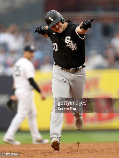 Jake Burger of the Chicago White Sox celebrates his two run home run in the second inning against the New York Yankees during game one of a double...